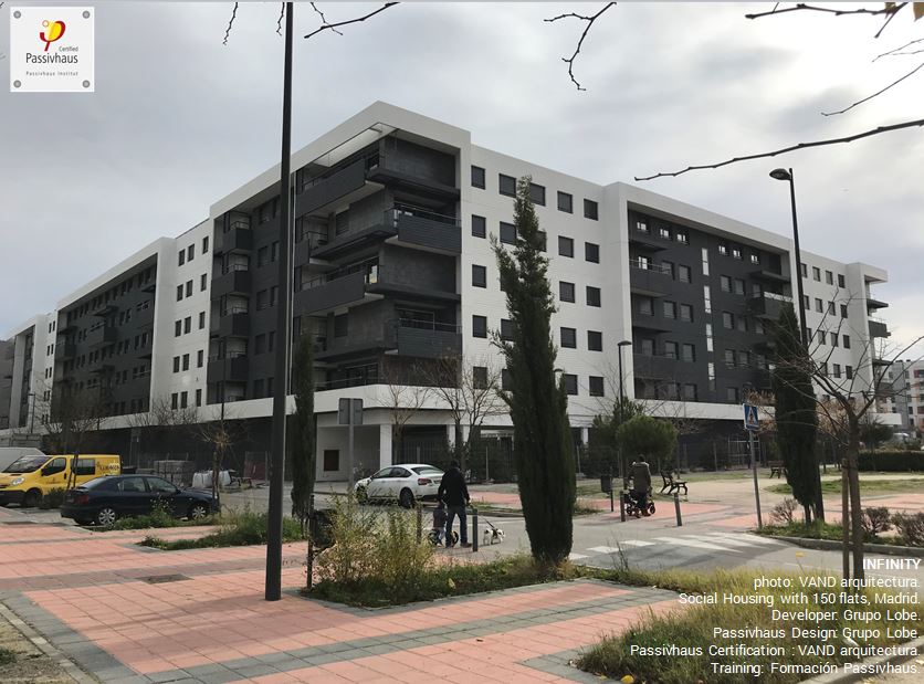 Exterior view of a social housing building constructed to the Passive House Standard. A large multi-storey black and white building with 150 apartmetns in total.